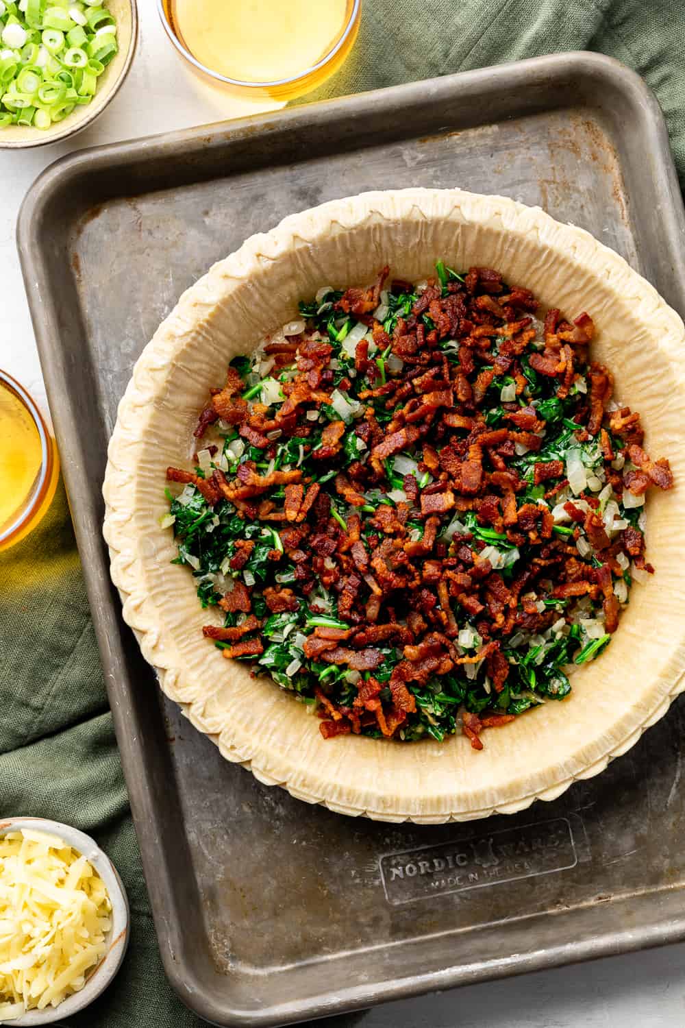 bacon and spinach in pie crust on sheet pan