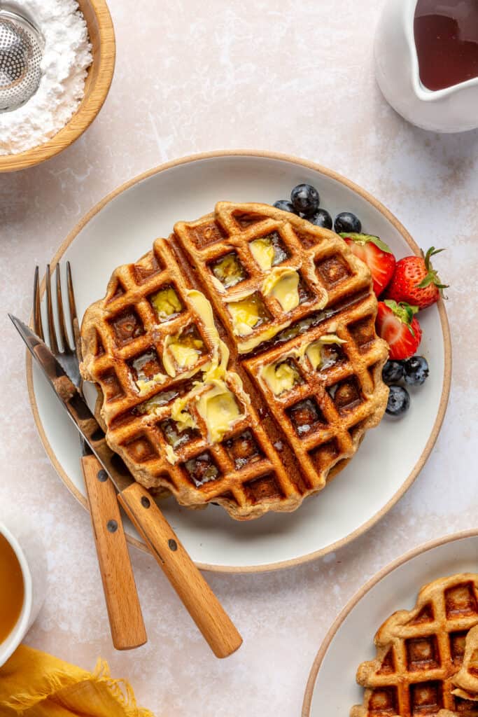 butter on waffles with fresh fruit