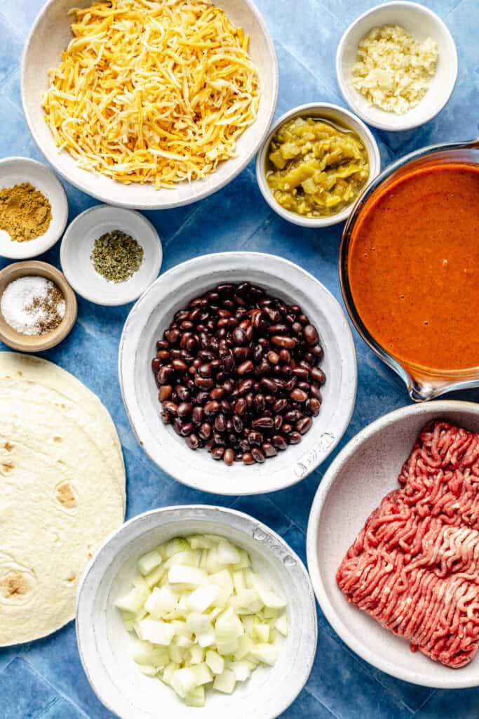 beef enchilada ingredients in bowls