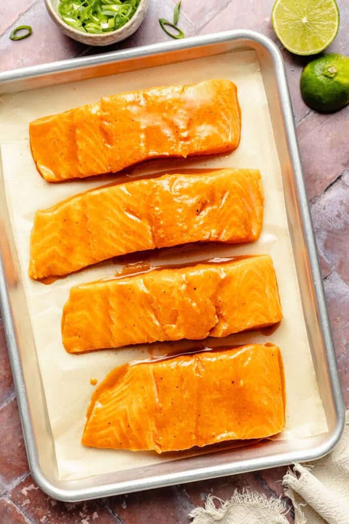 raw glazed salmon on lined sheet pan