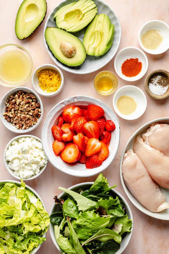 salad ingredients in bowls and on plates