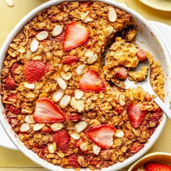 baked oatmeal in baking dish with serving spoon