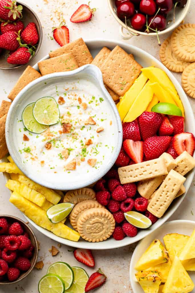 key lime pie dip on serving tray with fruit and cookies