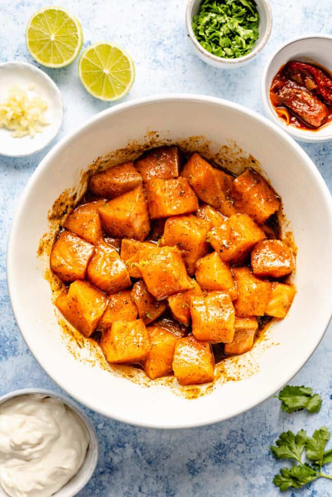 salmon bites marinating in bowl