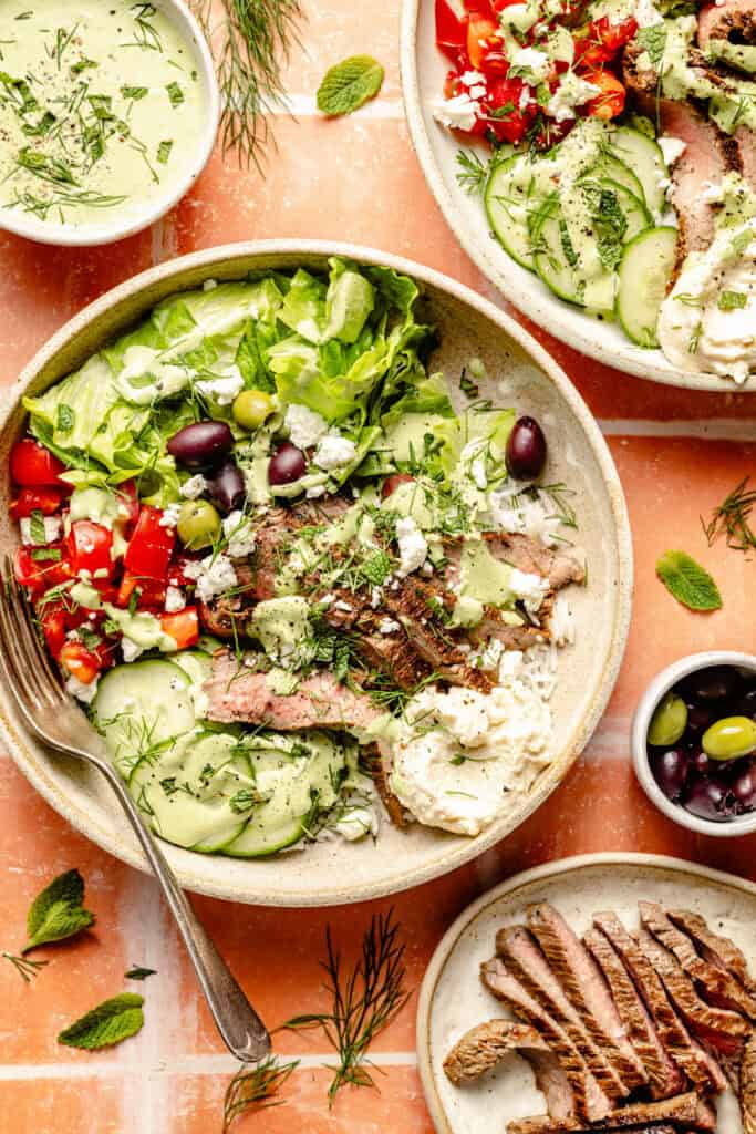 steak and rice bowls with toppings and fork