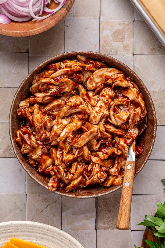 shredded chicken with bbq sauce in bowl