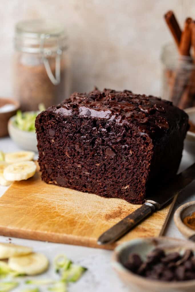 loaf of chocolate zucchini banana bread with knife