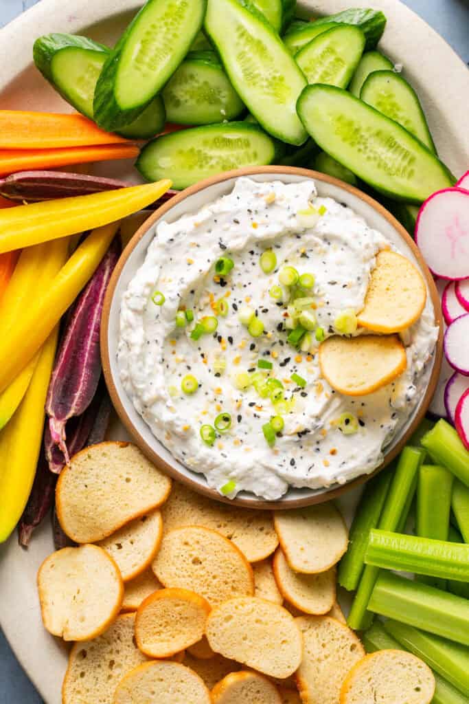 bagel dip with bagel chips and veggies