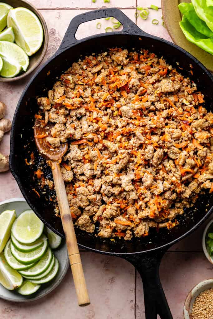 ground turkey and veggie mixture in skillet with spoon