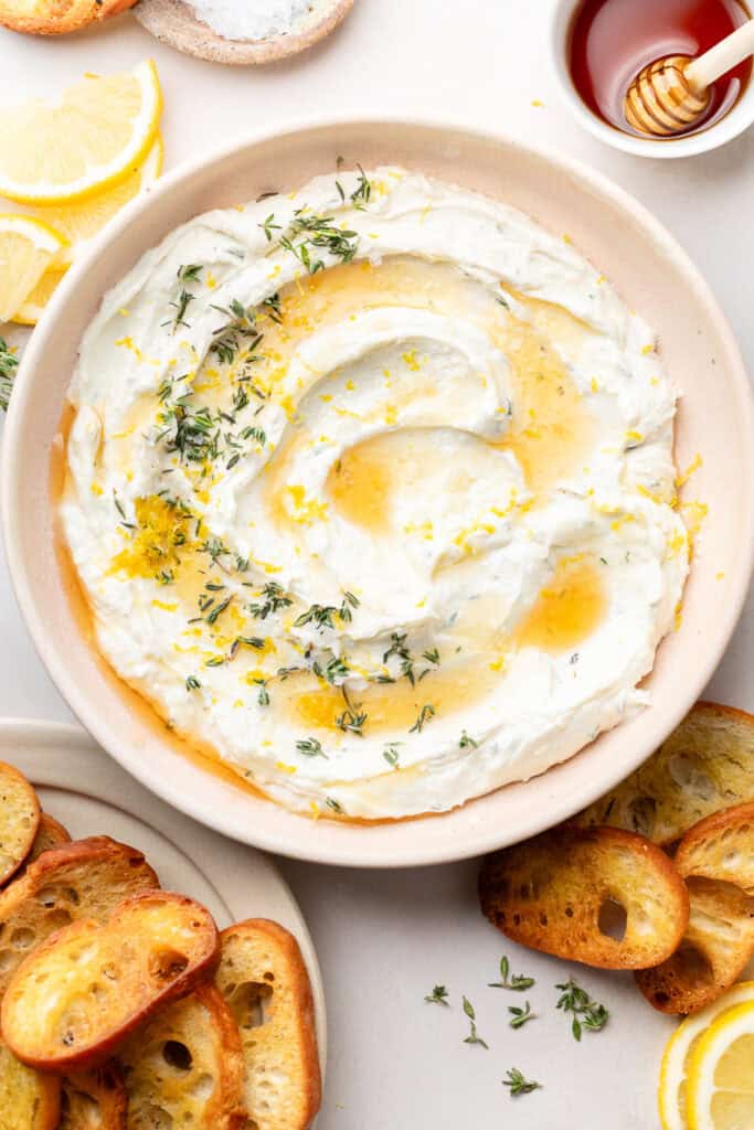 whipped goat cheese topped with honey and fresh herbs