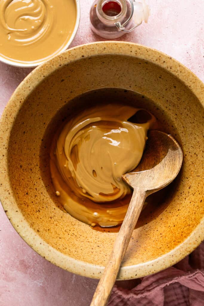 nut butter and maple syrup in mixing bowl