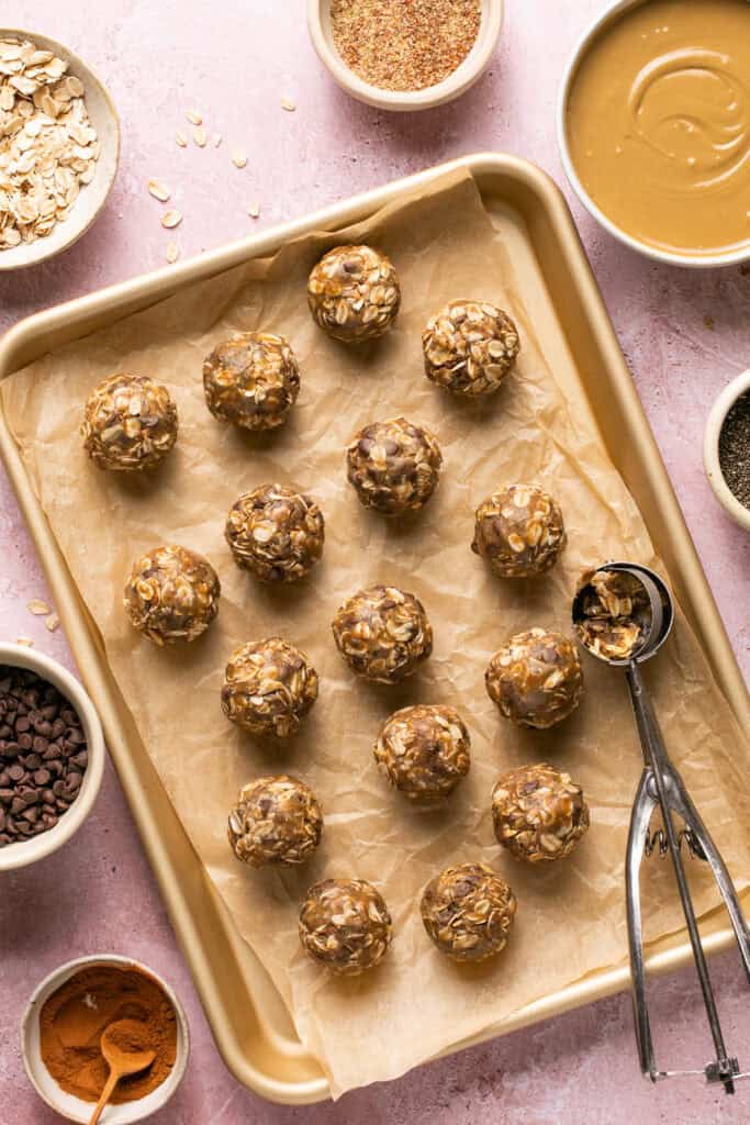 energy balls on sheet pan with scoop