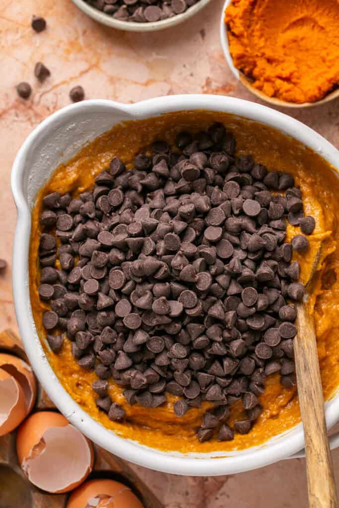 chocolate chips being stirred into batter