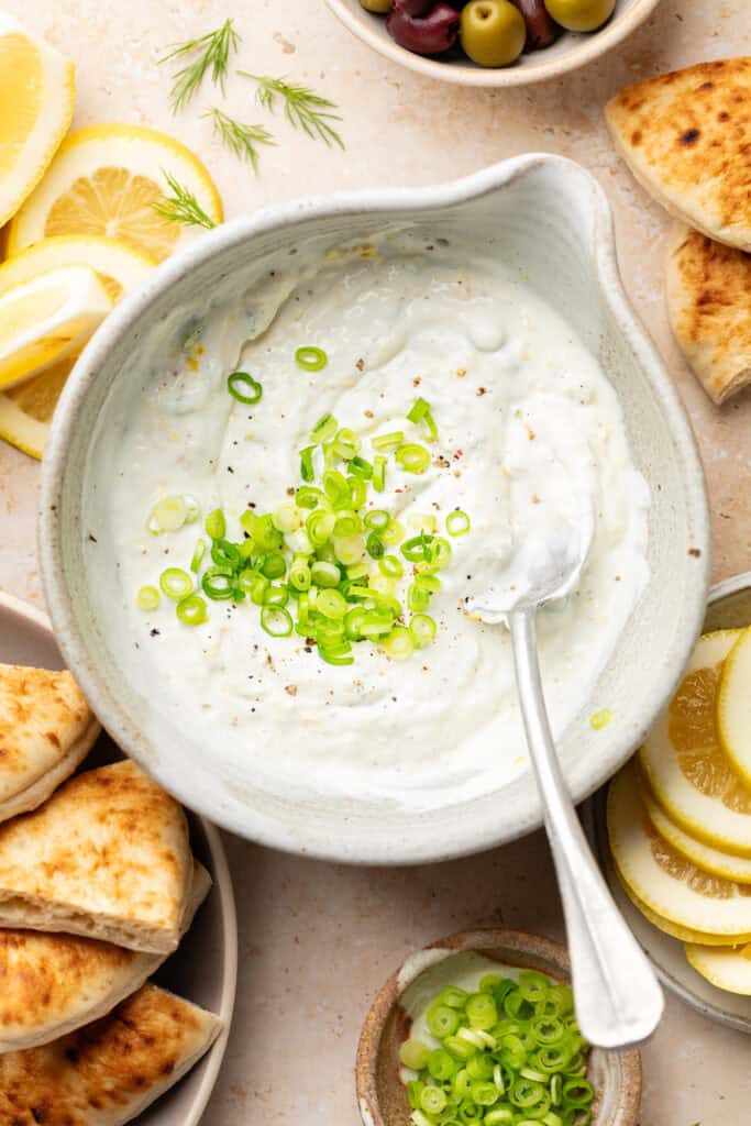 labneh dip with green onion in bowl