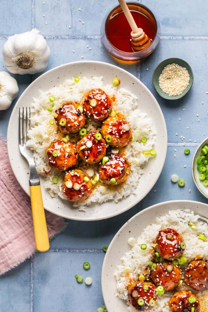 meatballs over rice with fork