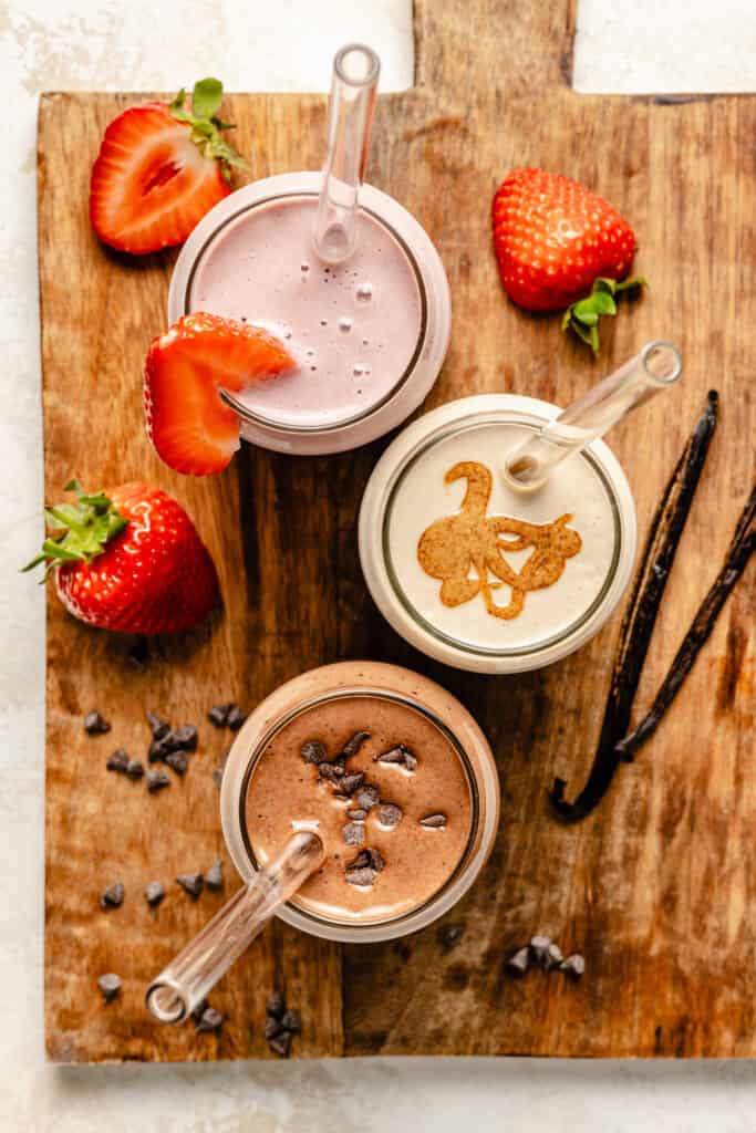 protein shakes on serving board with toppings