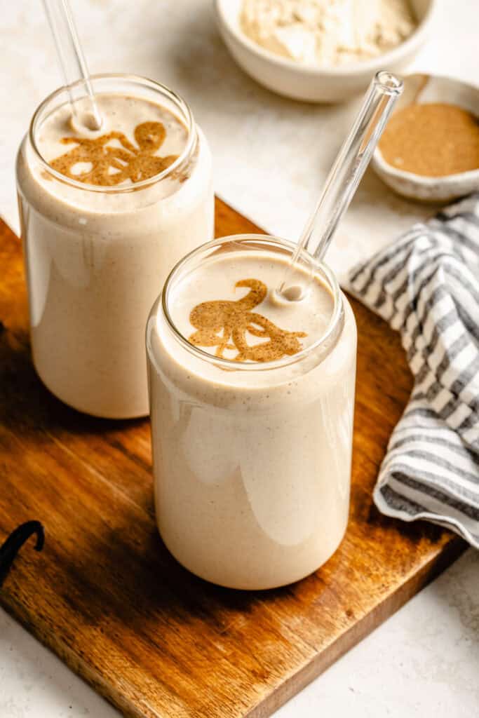 protein shakes topped with nut butter on wooden cutting board