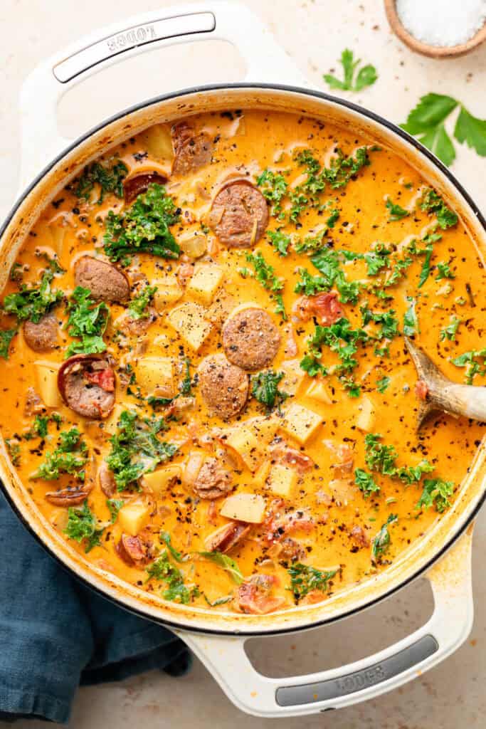 soup in dutch oven with wooden spoon