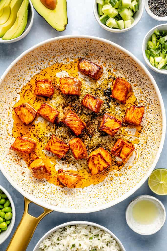 salmon cooking in pan