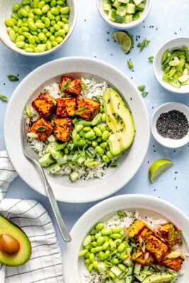 salmon bites over rice with avocado and edamame