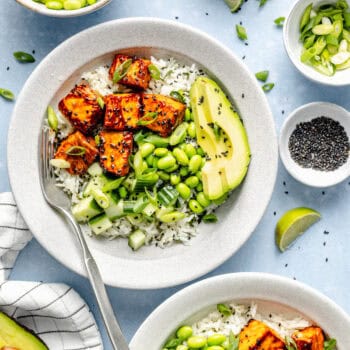 salmon bites over rice with avocado and edamame