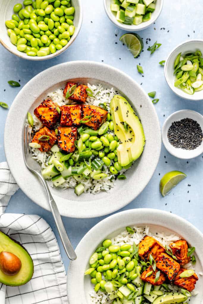 salmon bites over rice with avocado and edamame