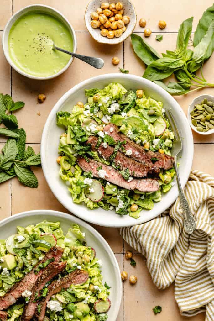 steak salad in bowl with fork 