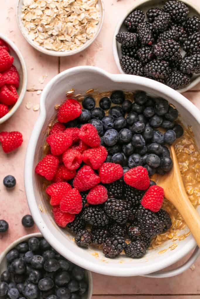 berries being mixed into oat mixture