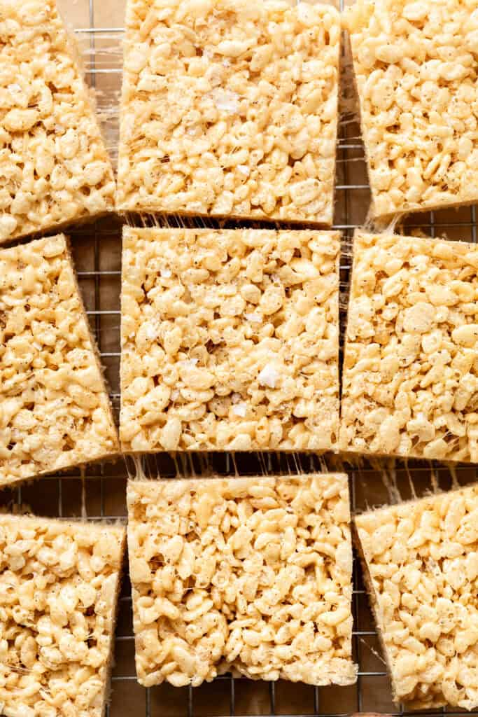 rice crispy treats cut into squares on wire rack