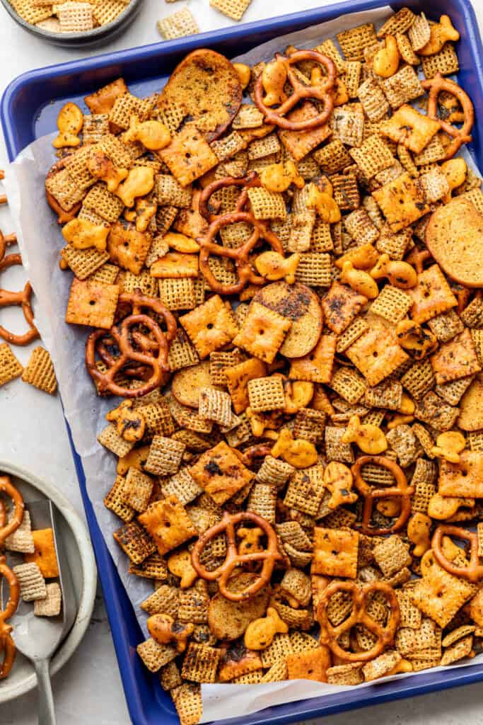 snack mix on parchment lined tray