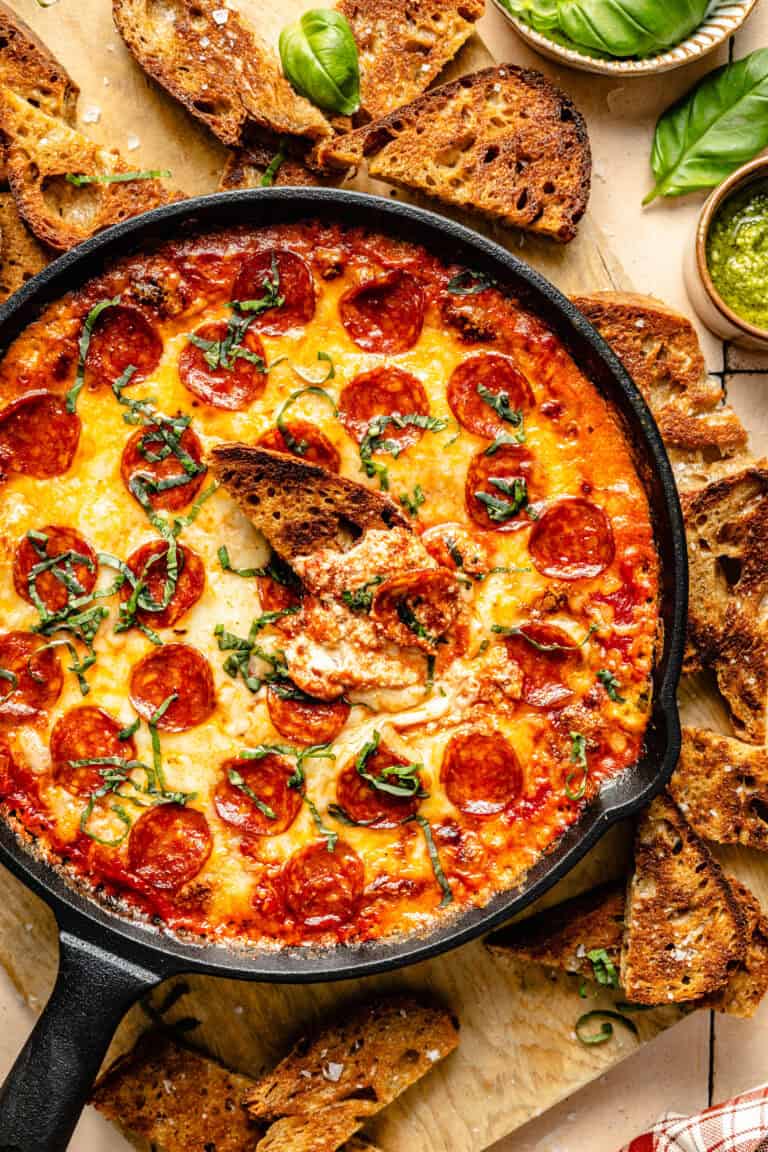 pizza dip with slice of toasted baguette