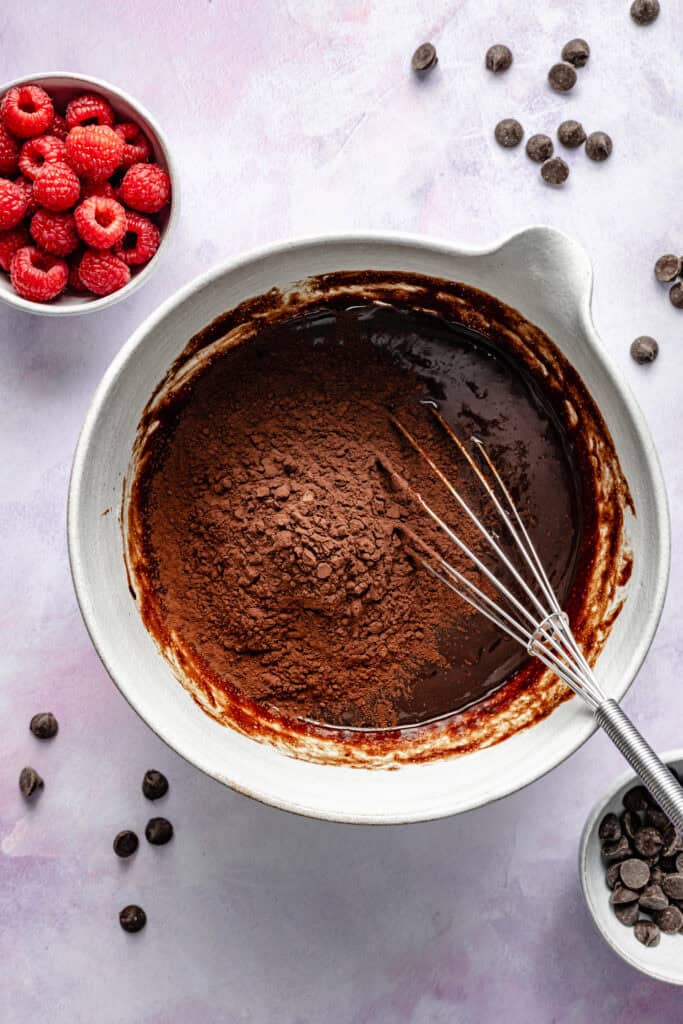 cocoa powder being added to cake batter