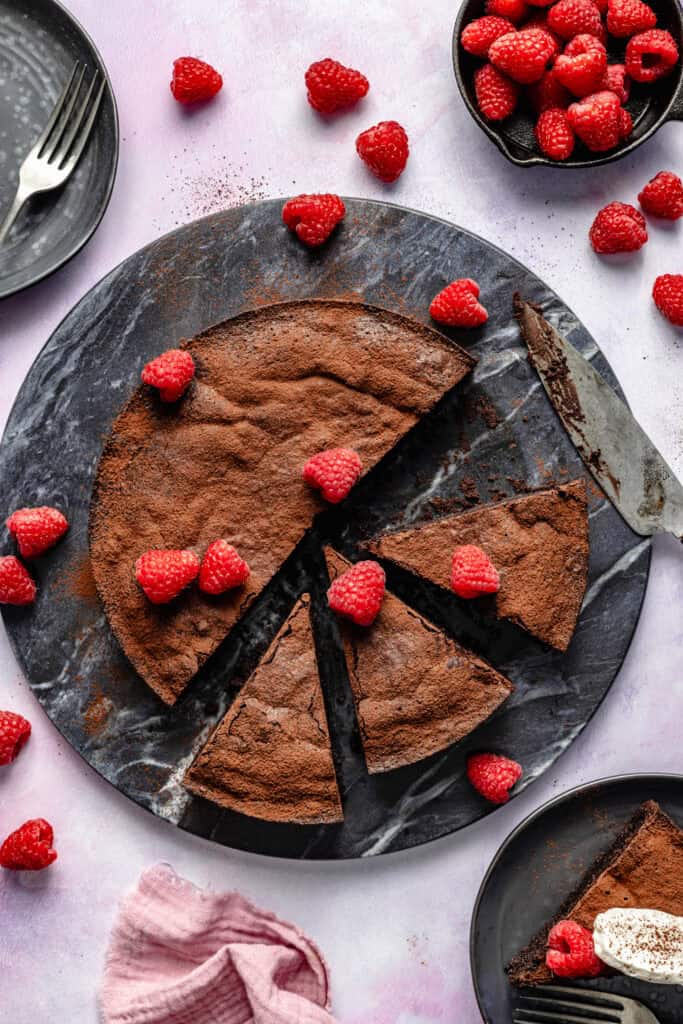 sliced cake topped with berries