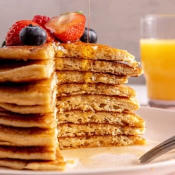 pancakes stacked on top of each other with fresh berries