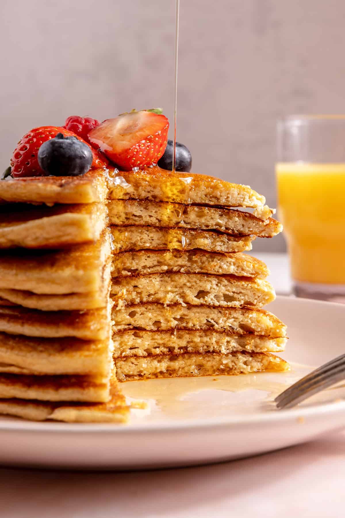 pancakes stacked on top of each other with fresh berries