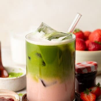 strawberry matcha latte in glass with straw