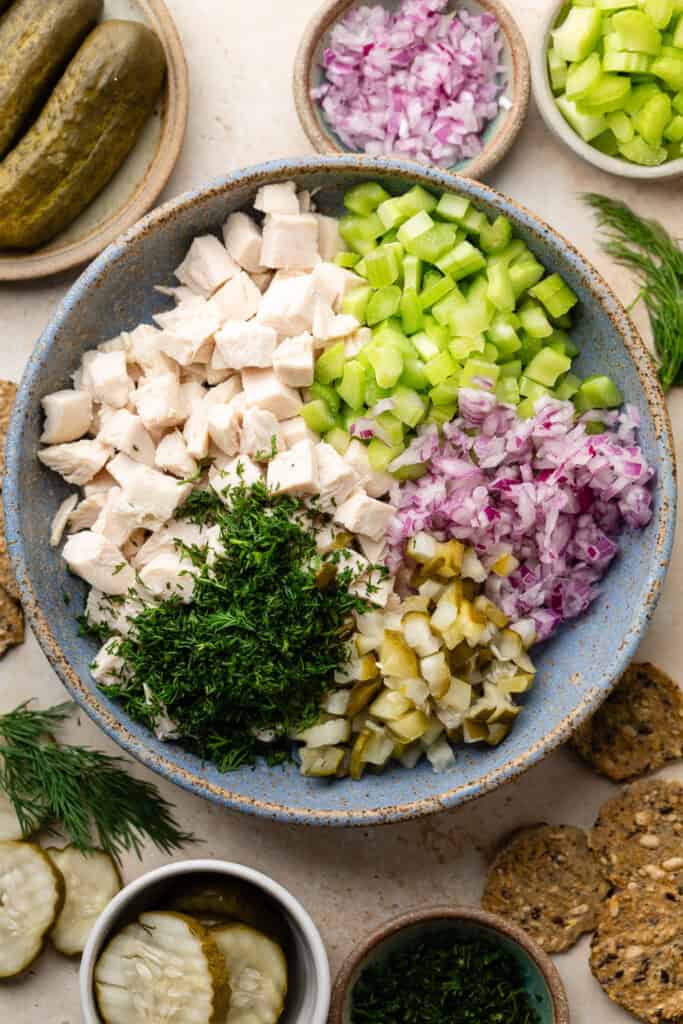 chicken salad ingredients in large mixing bowl