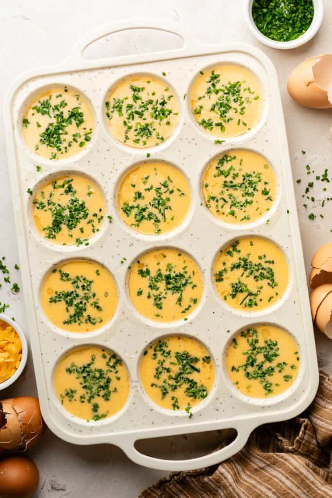 egg bites mixture in muffin tin