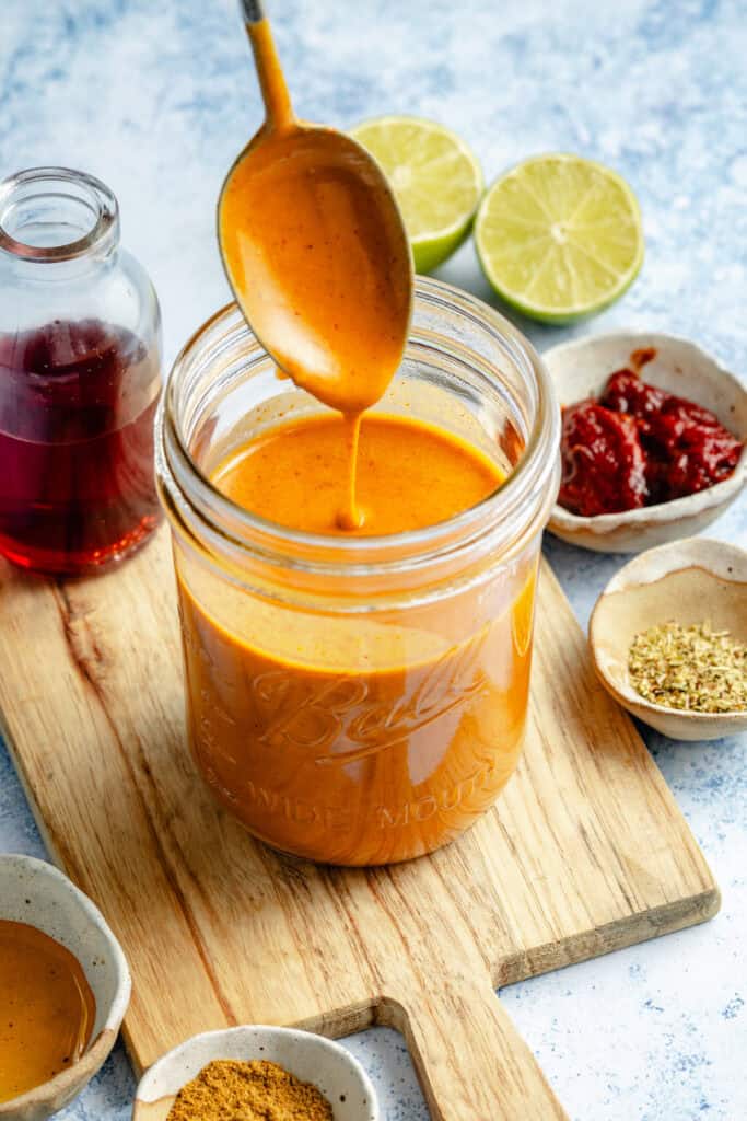 chipotle dressing in mason jar with spoon