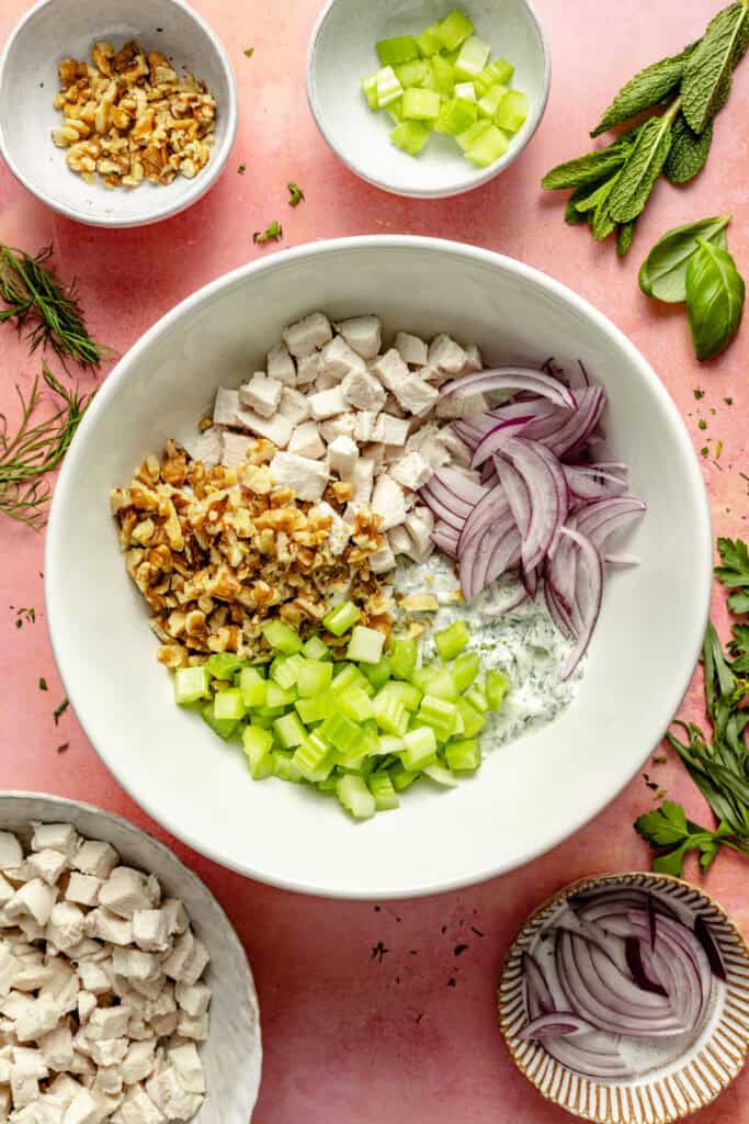 chicken salad ingredients in mixing bowl