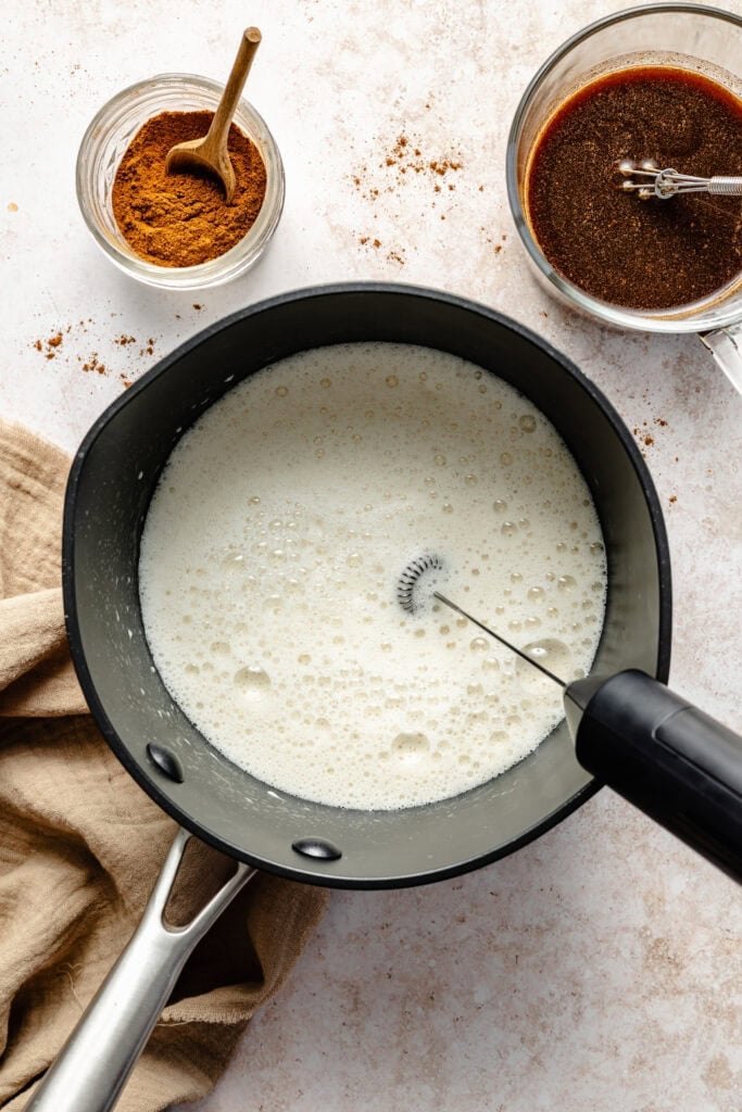 milk being frothed with milk frothed