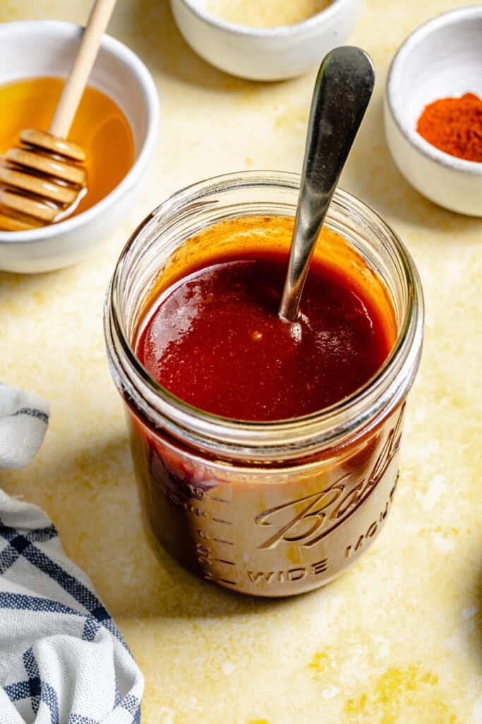 bbq sauce in mason jar with spoon