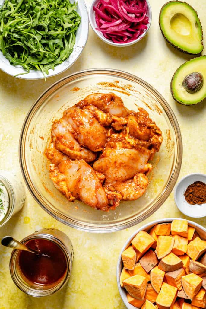 bbq marinated chicken in mixing bowl