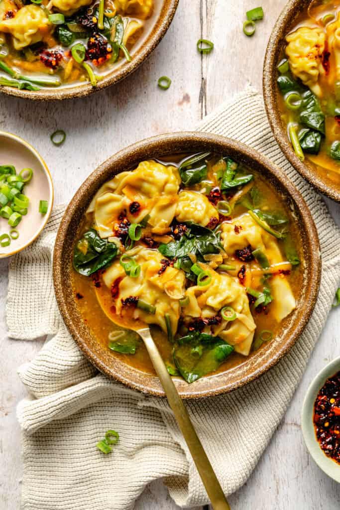 wonton soup in bowl with spoon