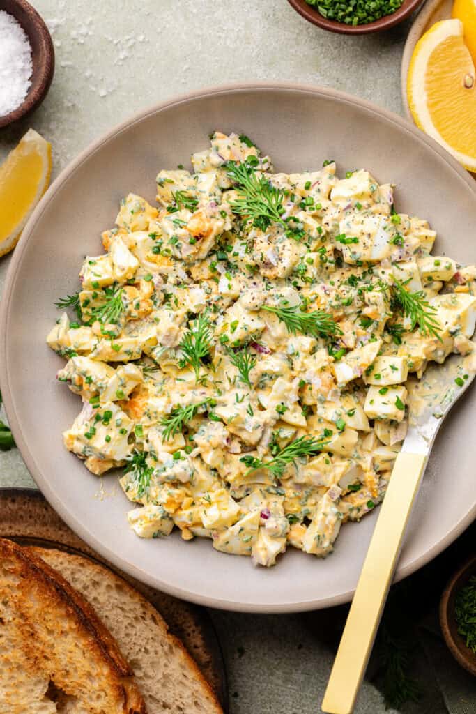 egg salad in bowl with mixing bowl