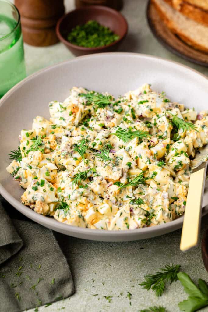 egg salad in bowl with mixing bowl