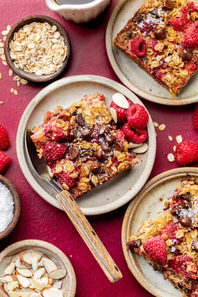 raspberry baked oatmeal on plates with fork