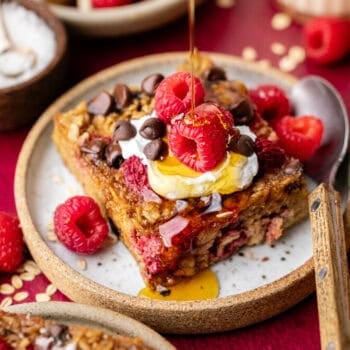raspberry baked oatmeal on plate with fork