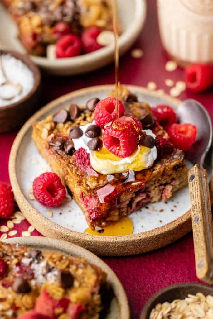raspberry baked oatmeal on plate with fork
