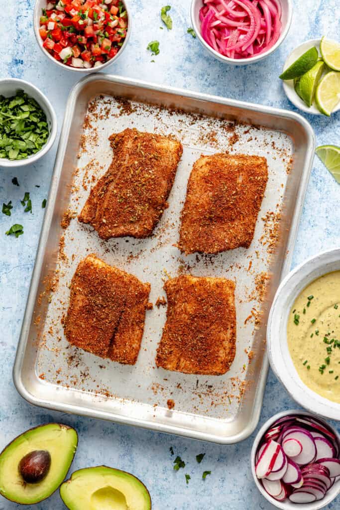 seasoned fish on sheet pan